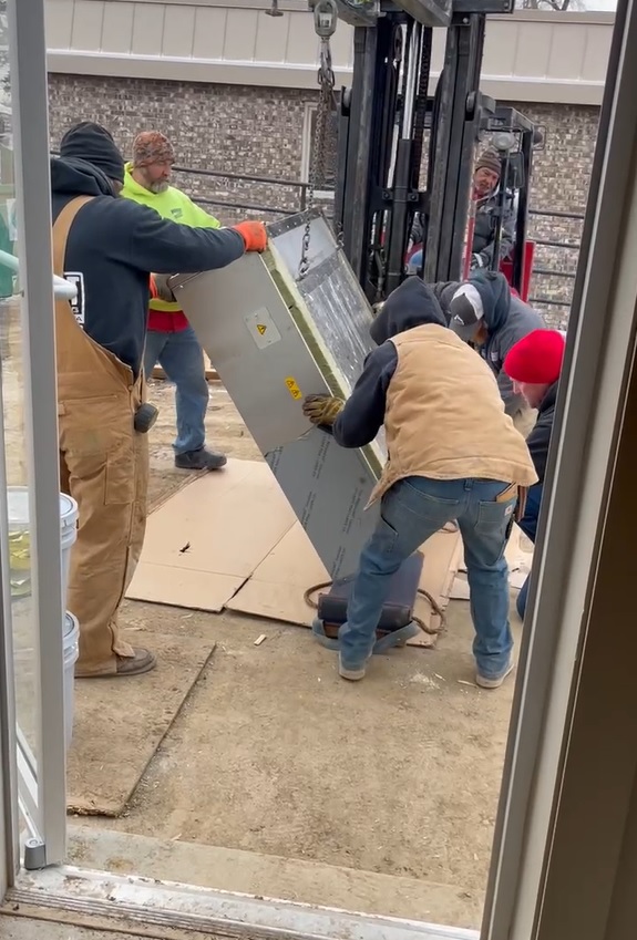 MONO deck oven being moved through door